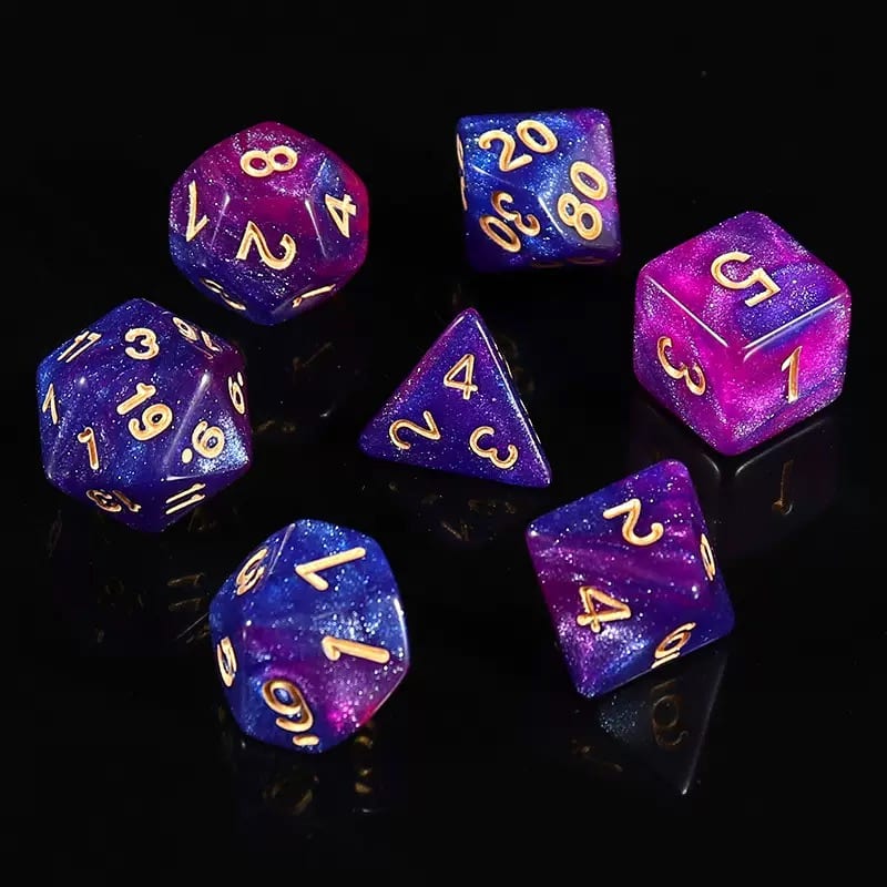 Blue and purple galaxy acrylic polyhedral dice with swirled color and glitter