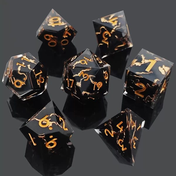 In-stock black and clear sharp-edge resin dice with gold ink veins and gold numbers