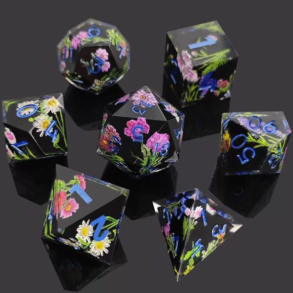 In-stock black sharp-edge resin dice with pink and white flowers and blue numbers